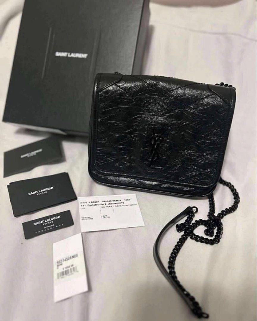 Saint Laurent Black Leather Chain Bag (Category: Luxury Bags & Wallets) located in Pasig City. Submitted by lalalooza (Listing ID 1447898378, Image 1). Description: - Authentic Saint Laurent black leather chain bag - Iconic black YSL logo - Quilted detailing on front flap - Includes original box and authenticity cards - Interior with multiple card slots - Black chain strap for shoulder or crossbody wear - Ideal for nights out or everyday use.