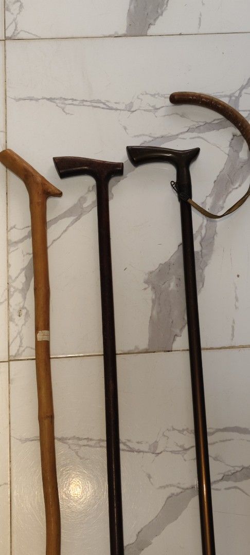 Set of 4 Walking Canes - Various Styles (Category: Medical Supplies & Tools) located in Bulacan. Submitted by babz30261 (Listing ID 1448073874, Image 1). Description: - Set of 4 walking canes - One light wood/bamboo cane - Three dark wood or metal canes - Various handle shapes - Two canes with rubber tips - One cane with a leather strap - Perfect for collectors or mobility assistance.