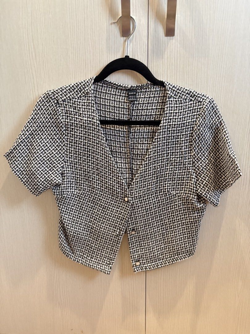SHEIN Black & White Tweed Cropped Button-Up Top (Category: Blouses) located in Quezon City. Submitted by mikamdr (Listing ID 1447979335, Image 1). Description: - Cute cropped top - Black and white tweed pattern - Short sleeves - V-neckline - Pearl-like buttons down the front - Pairs well with high-waisted bottoms - Ideal for a chic, put-together look.