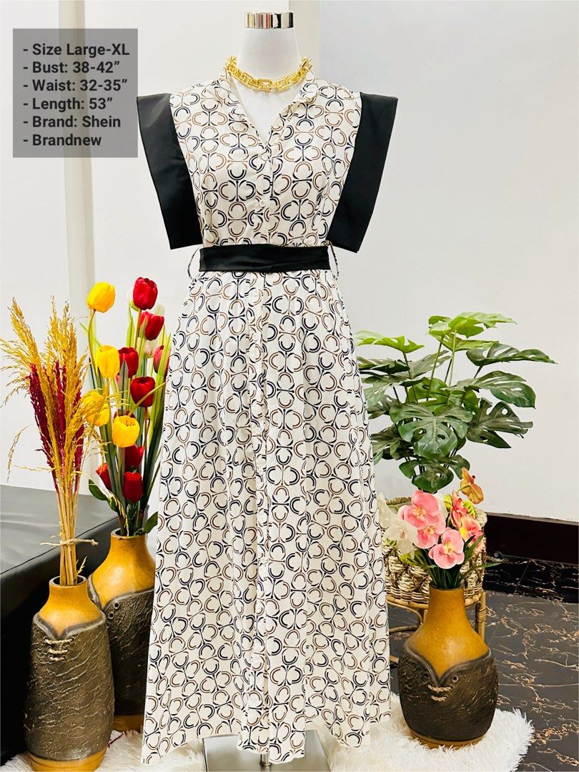 Shein Printed V-Neck Maxi Dress (Category: Dresses) located in Bugallon. Submitted by itskierbrielle (Listing ID 1448049817, Image 1). Description: - Chic Shein midi dress - Eye-catching geometric print - Flattering V-neckline - Stylish black belt detail at the waist - Sleeveless design with black shoulder accents - Length: 53 inches - Fits bust: 38-42 inches - Fits waist: 32-35 inches - Perfect for dressing up or down.