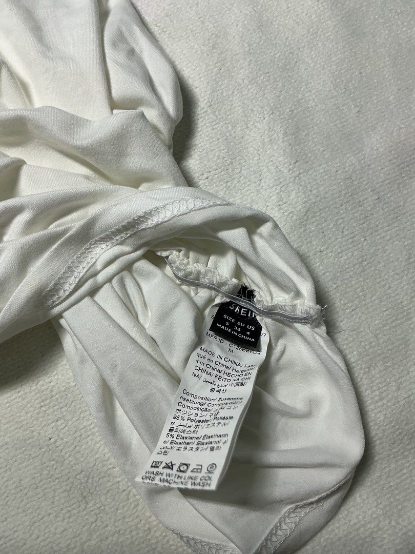 SHEIN White One Shoulder Ruched Top Size M (Category: Blouses) located in Makati City. Submitted by studentista (Listing ID 1448068001, Image 2). Description: - Stylish white one-shoulder top - Features flattering ruching detail on the side - Made from a comfortable and stretchy polyester-spandex blend - Versatile for casual outings or dressing up - Never used!.