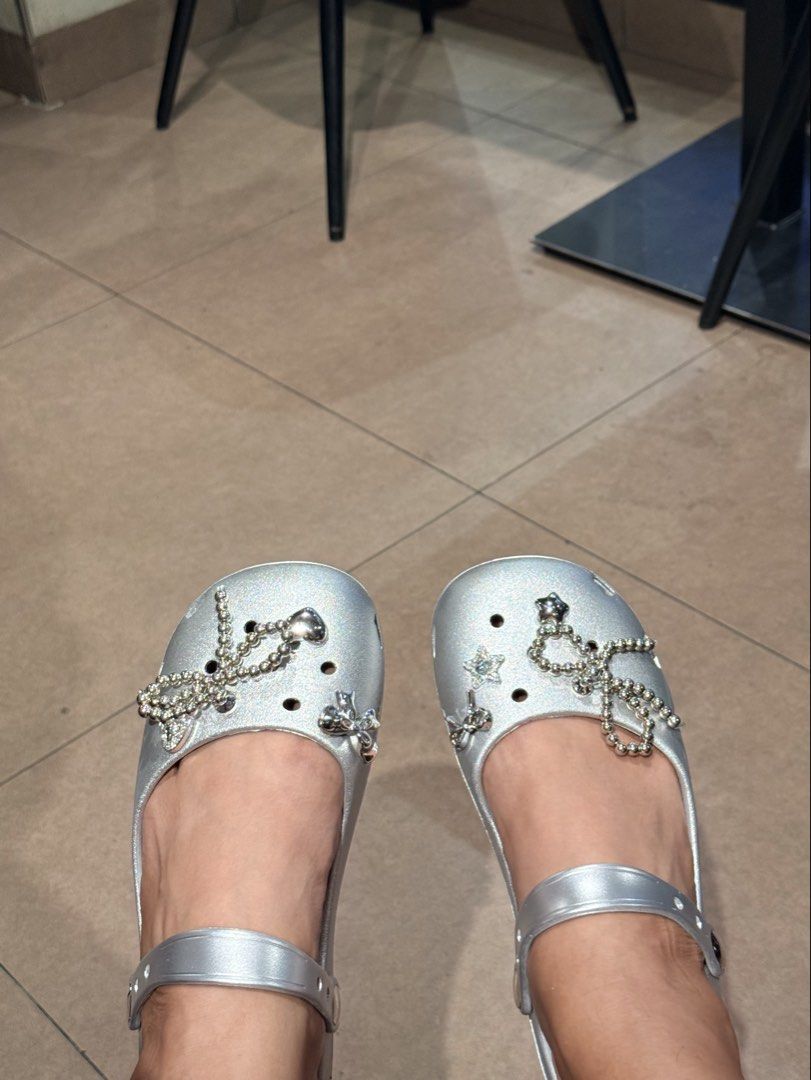 Silver clogs with charms (Category: Flats & Sandals) located in Pasay City. Submitted by sandybuggy (Listing ID 1447886029, Image 2). Description: 25.5cm .