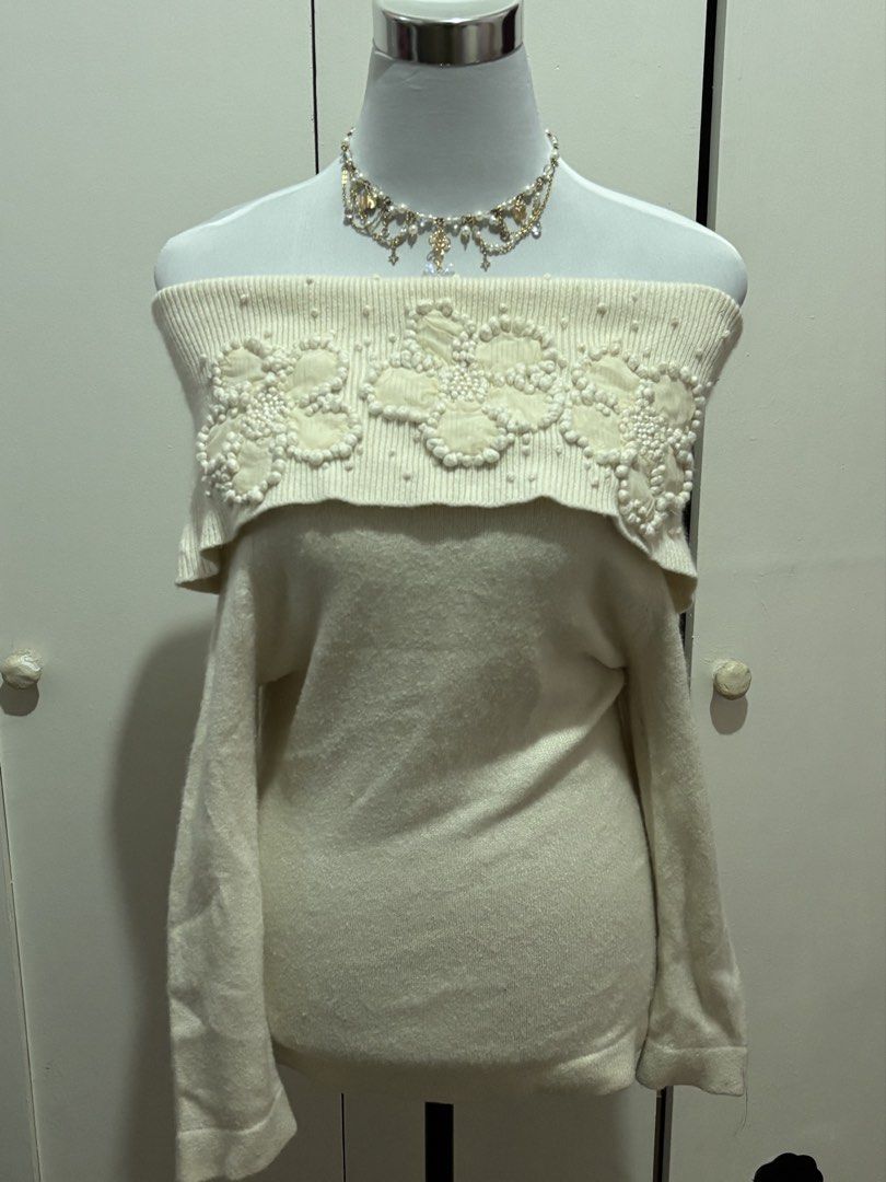 (s-m) cream off-shoulder sweater with beads (Category: Longsleeves) located in Paranaque City. Submitted by prelovedtinez (Listing ID 1446853978, Image 1). Description: - has 3d flower embellishments on the neckline - can fit up to semi L (bust 34) but medyo bitin na sa arms. letting it go for this reason kahit super cute niya.