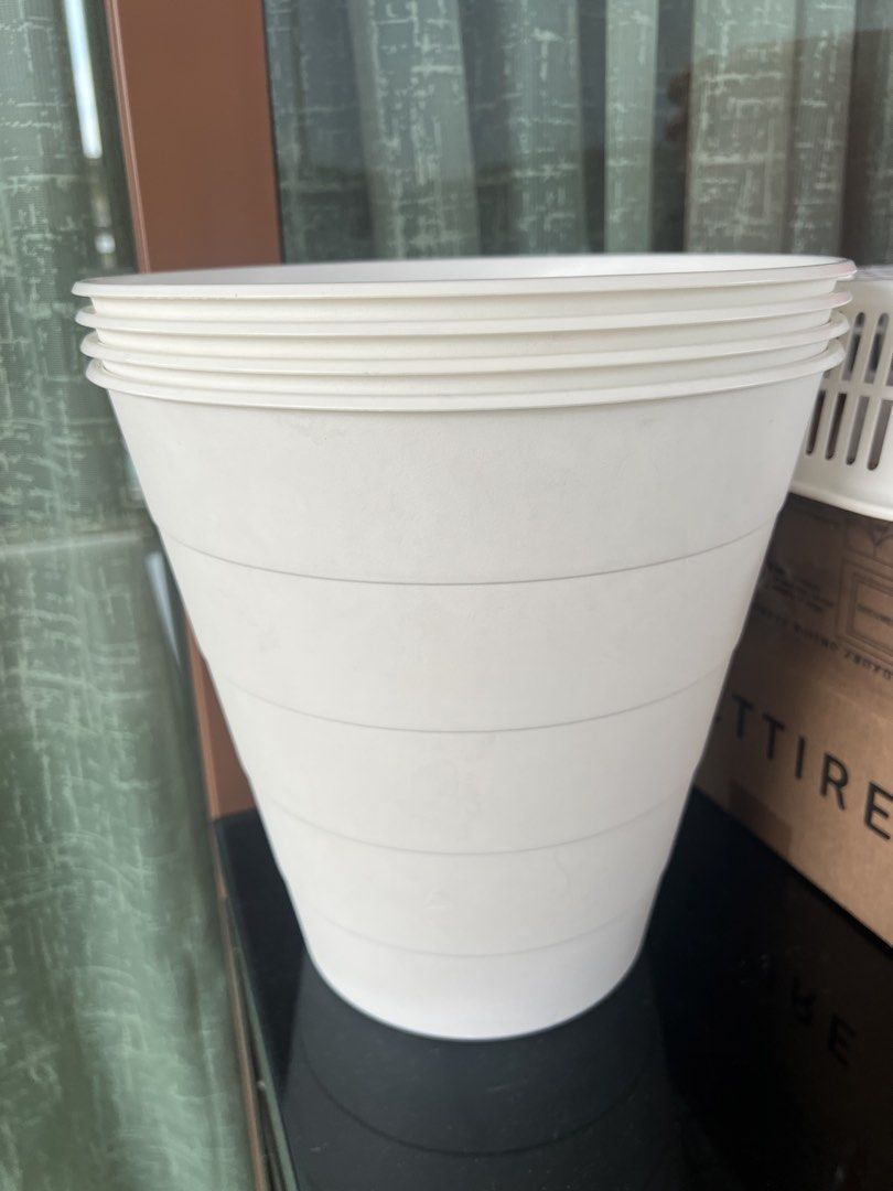 Stackable White Plastic Pots Set (Category: Pots & Planters) located in Singapore. Submitted by nazihamana (Listing ID 1447975475, Image 1). Description: - Set of white plastic plant pots - Stackable design for easy storage - Comes in multiple sizes - Perfect for starting seedlings or small plants - Suitable for both indoor and outdoor use.