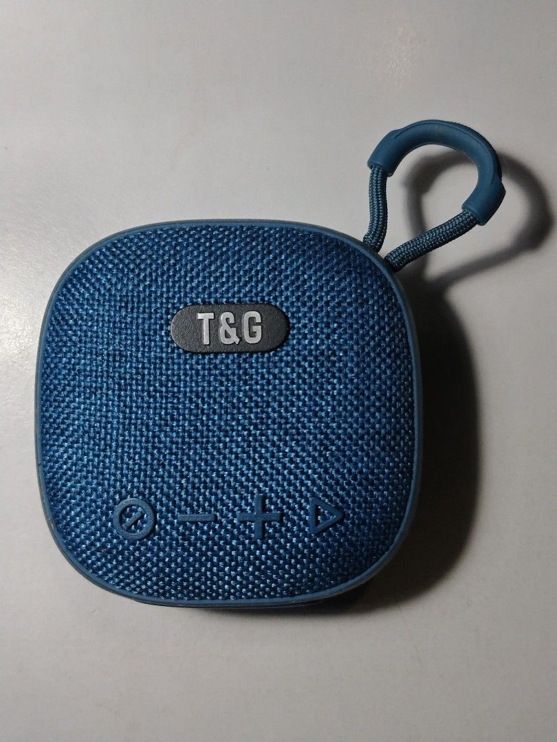 T&G Portable Bluetooth Speaker with USB, SD, AUX (Category: Soundbars, Speakers & Amplifiers) located in Quezon City. Submitted by 09277011179 (Listing ID 1447949397, Image 1). Description: - Blue T&G portable speaker - Stylish fabric finish - Convenient carry loop - Bluetooth connectivity - Additional playback options: USB, SD card, AUX ports - Compact and lightweight for easy portability - Perfect for enjoying music anywhere -missing earphones 