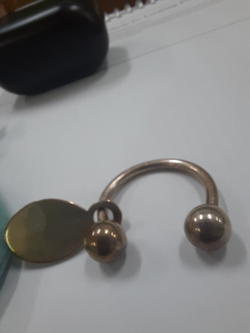 Tiffany & Co keychain (Category: Luxury Accessories) located in Quezon City. Submitted by reuserecyclereclaim (Listing ID 1447916972, Image 3). Description: - Authentic Tiffany & Co. keychain - Classic 'Return to Tiffany' tag - Made of sterling silver - Ball end and ring closure - Perfect for keys or as a bag charm - Comes with original Tiffany blue pouch.