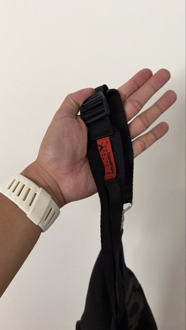 Topologie Sling Messenger Bag Black (Category: Sling Bags) located in Paranaque City. Submitted by ricafortmarco (Listing ID 1447961379, Image 3). Description: - Brand: Topologie - Color: Black exterior, bright red interior - Features: Multiple zippered compartments for secure storage - Strap: Adjustable for personalized comfort - Style: Minimalist design - Ideal for: Everyday use, travel.