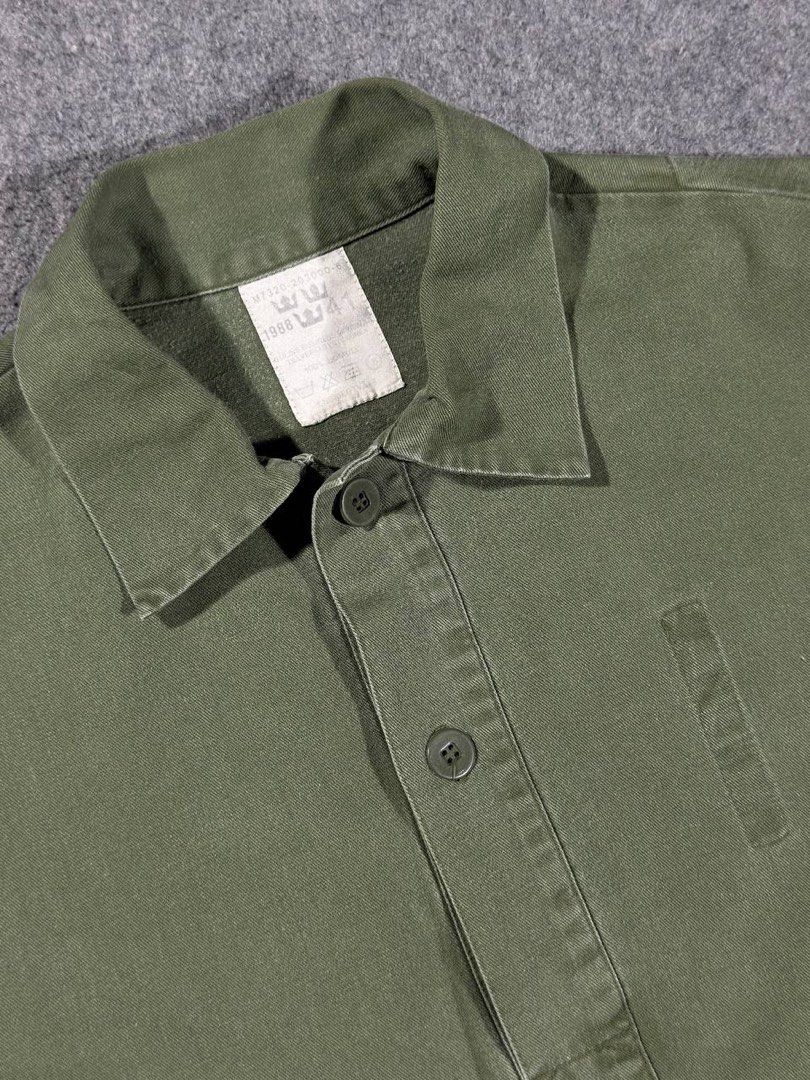 Vintage 1988 Swedish Army M-55 (Category: Coats, Jackets and Outerwear) located in Zamboanga. Submitted by zhifay (Listing ID 1448024245, Image 2). Description: Vintage 1988 Swedish Army M-55 Color: Olive Drab / Military Green Size: 41 (Fits like Large / Oversized Medium) Measurements: Pit to Pit: 25inches Length: 31inches Features classic half-button pullover design, reinforced square box-stitch placket, and official "Tre Kronor" three-crown nec