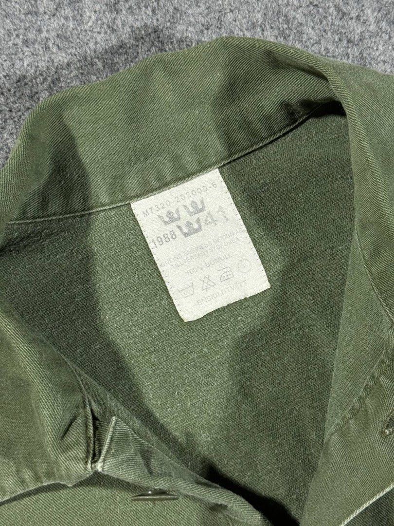 Vintage 1988 Swedish Army M-55 (Category: Coats, Jackets and Outerwear) located in Zamboanga. Submitted by zhifay (Listing ID 1448024245, Image 3). Description: Vintage 1988 Swedish Army M-55 Color: Olive Drab / Military Green Size: 41 (Fits like Large / Oversized Medium) Measurements: Pit to Pit: 25inches Length: 31inches Features classic half-button pullover design, reinforced square box-stitch placket, and official "Tre Kronor" three-crown nec