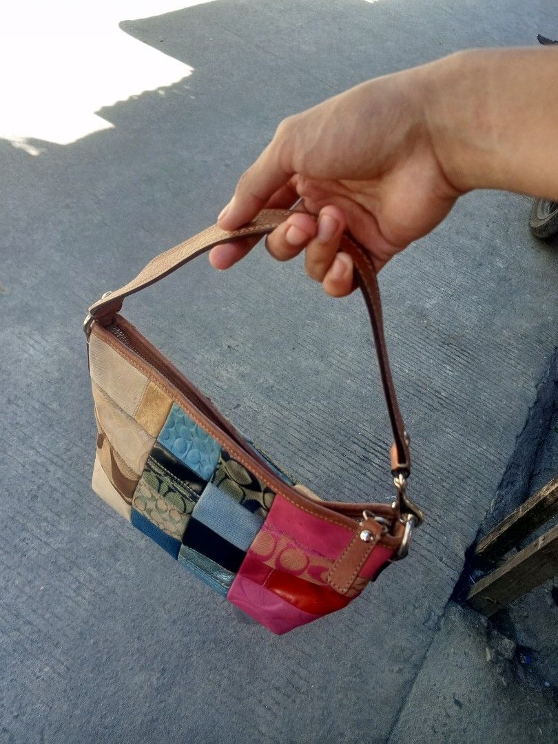 Vintage Coach Patchwork Multi-Color Shoulder Bag (Category: Luxury Bags & Wallets) located in Manila. Submitted by skelebento60011 (Listing ID 1447989773, Image 2). Description: - Adorable Coach shoulder bag - Unique patchwork design with Coach monogram, colorful leather, and fabric squares - Tan leather strap and trim - Secure zipper closure - Bright blue fabric interior - Perfect for adding a pop of color - Approximate dimensions: 10 inches (le