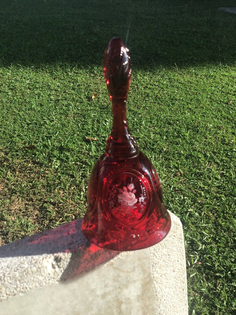 Vintage Fenton Ruby Red Art Glass Hand bell Featuring Hand Painted White Roses with Signed. (Category: Vases & Decorative Bowls) located in Kuala Lumpur. Submitted by gagalamblamb_1974 (Listing ID 1447937065, Image 3). Description: - Measurements: Approximately 7” height. - Hand Painted with Artist’s Signature. - Good used condition without chips nor cracks. Without Clapper. Refer photos as part of the item’s description. - Item sold as it is..