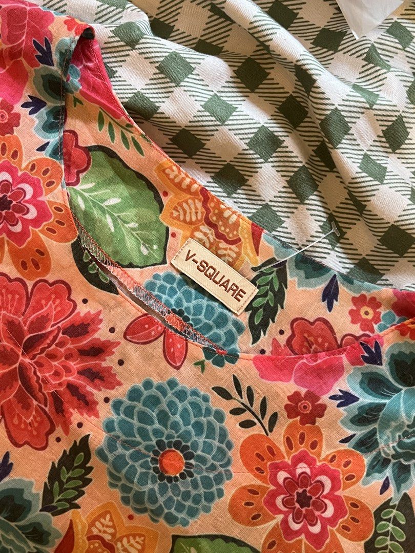 V-SQUARE Floral Print 3/4 Sleeve Top (Category: Blouses) located in Pasay City. Submitted by losient (Listing ID 1448033304, Image 3). Description: - Cute floral print top from V-SQUARE - Features 3/4 sleeves - Relaxed fit - Beautiful mix of orange, pink, blue, and green flowers on a light peach background - Ideal for casual wear - Easily pairs with jeans or shorts.