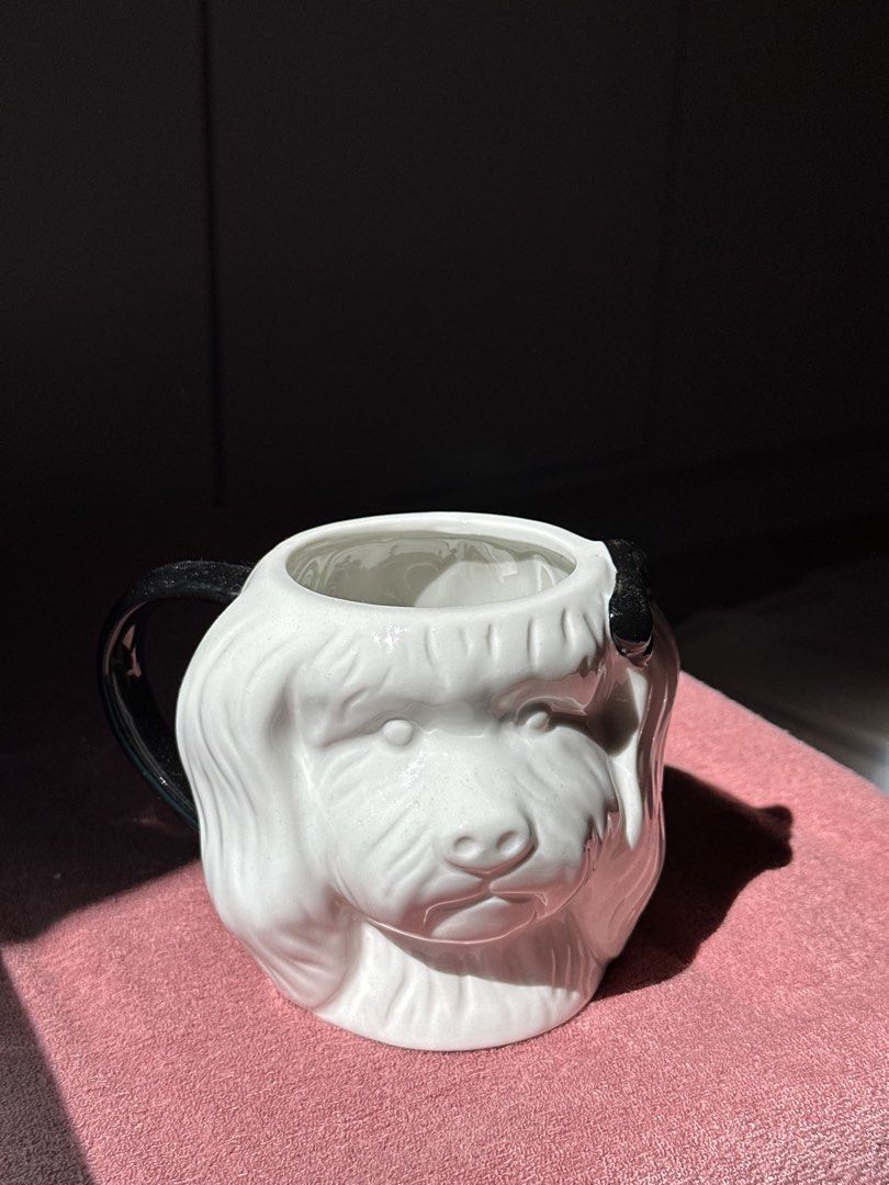 White Dog Face Mug with Black Handle and Ears (Category: Coffee & Tea Tableware) located in Caloocan City. Submitted by videsamaru29 (Listing ID 1448012168, Image 3). Description: - Adorable dog face design - White ceramic with black ear and handle accents - Ideal for coffee or tea - A fun addition to your kitchenware - A must-have for dog lovers! - Dimensions: Approx. X inches tall, Y inches wide (including handle).