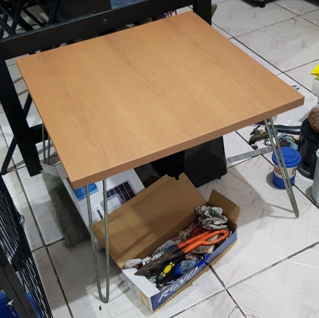 Wooden Folding Table with Metal Legs (Category: Tables & Sets) located in Makati City. Submitted by shopaholicsgallery (Listing ID 1448019342, Image 2). Description: - Compact wooden table with natural light wood grain - Sturdy metal hairpin legs - Perfect for small spaces, as a side table, or for temporary use - Easy to move around - 600cm x 600cm x 450mm.