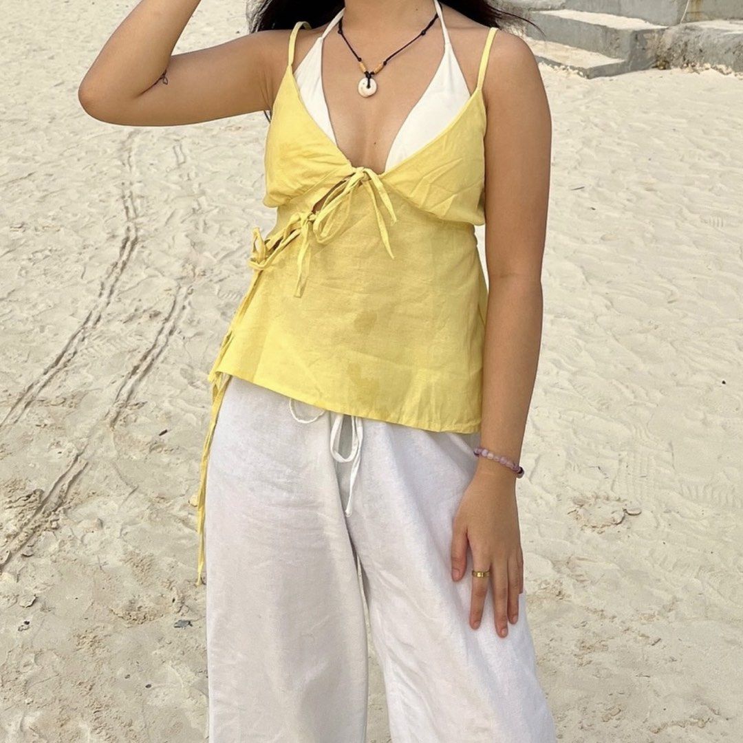 Yellow Tie Front Cut Out Camisole Top (Category: Sleeveless) located in Kalibo. Submitted by 97blnk (Listing ID 1447944035, Image 2). Description: - ye camisole top - self tie - side cut-out details - adjustable straps.