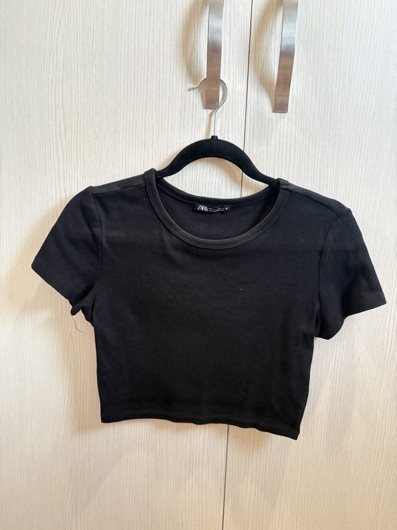 Zara Black Cropped T-Shirt (Category: Shirts) located in Quezon City. Submitted by mikamdr (Listing ID 1447941364, Image 1). Description: - Basic black cropped t-shirt from Zara - Features short sleeves and a round neckline - Simple and versatile design - Perfect for layering or wearing solo - Effortlessly pairs with any wardrobe staple.