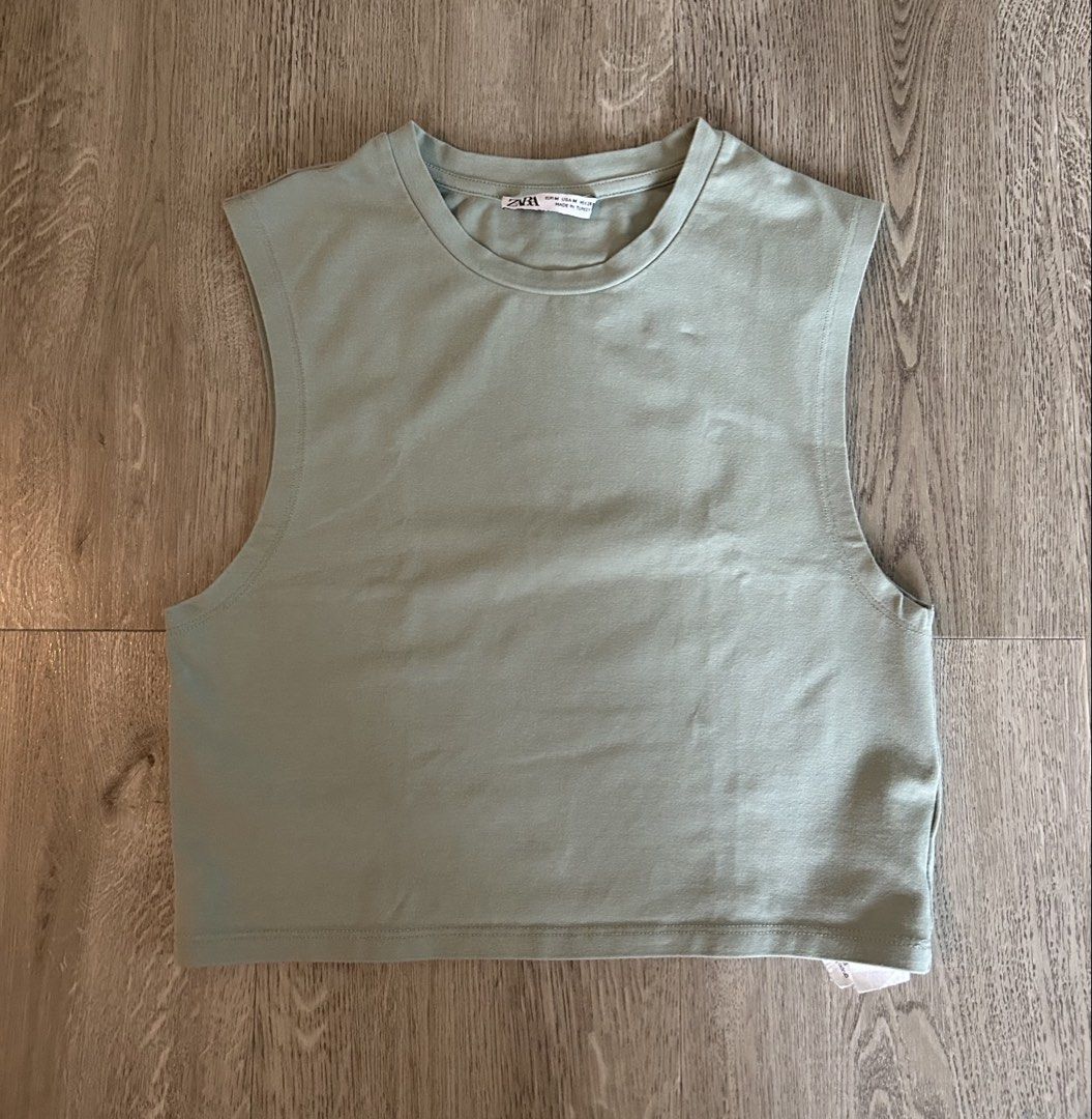 Zara Sleeveless Cropped Top - Light Green (Category: Sleeveless) located in Makati City. Submitted by ellabernaro_ (Listing ID 1447974419, Image 1). Description: - Zara cropped sleeveless top - Light green color - Body Hugging fit - Crew neckline - Ideal for casual outfits or layering.