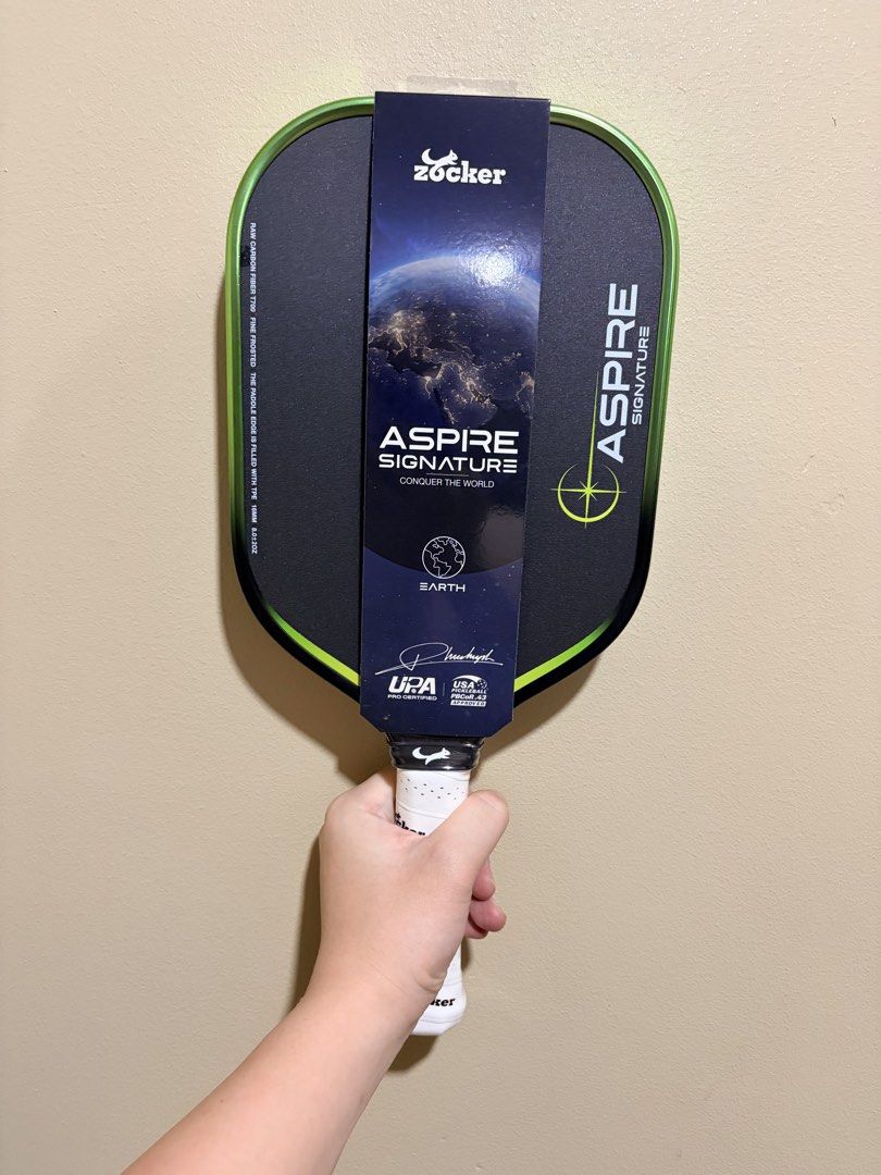 Zocker Aspire Signature (Pickleball Paddle) (Category: Other Sports Equipment and Supplies) located in Manila. Submitted by dinkrpaddlelab (Listing ID 1448043596, Image 1). Description: For Sale Zocker Aspire Signature 👉🏻 Brand New 👉🏻 Onhand 👉🏻 16 mm 👉🏻 Honeycomb Core Available colors: • Neptune (Blue) • Earth (Green) • Sun (Yellow) Comes with: • Free edge tape • Free overgrip Price: ₱9,499 (srp 10k+) For other paddles, check out @dinkrpa