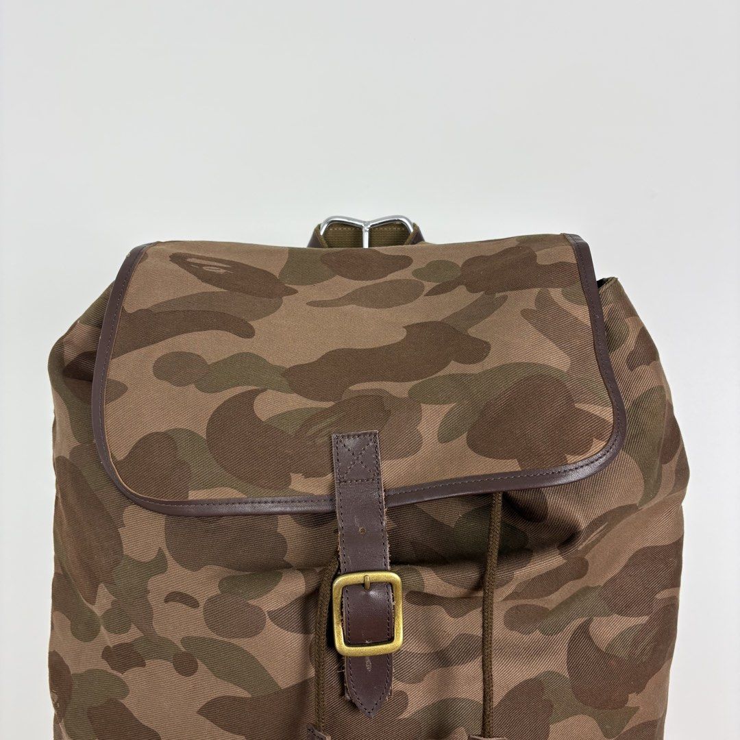 A Bathing Ape Brown Camo Rucksack Backpack (Category: Backpacks) located in Calamba. Submitted by 2muchclothes_ (Listing ID 1448199097, Image 2). Description: Measurements Width: 18 Length: 17 Depth: 6 Flaws: Chip off leather lining .