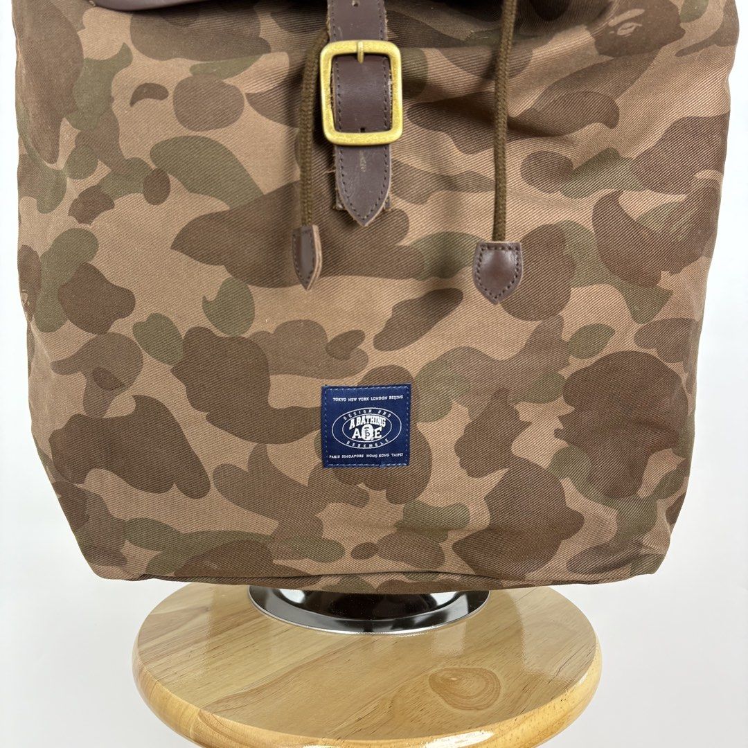 A Bathing Ape Brown Camo Rucksack Backpack (Category: Backpacks) located in Calamba. Submitted by 2muchclothes_ (Listing ID 1448199097, Image 3). Description: Measurements Width: 18 Length: 17 Depth: 6 Flaws: Chip off leather lining .