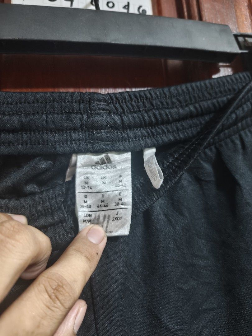 Adidas Black Shorts with White Stripes (Category: Shorts) located in Quezon City. Submitted by makmakramirez (Listing ID 1448110025, Image 3). Description: size 27-38 length 13inches - Adidas black shorts - White stripes on sides - Elastic waistband with drawstring - Size M (Japan) - Ideal for sports or casual wear - Comfortable material loc Santa Lucia novaliches.