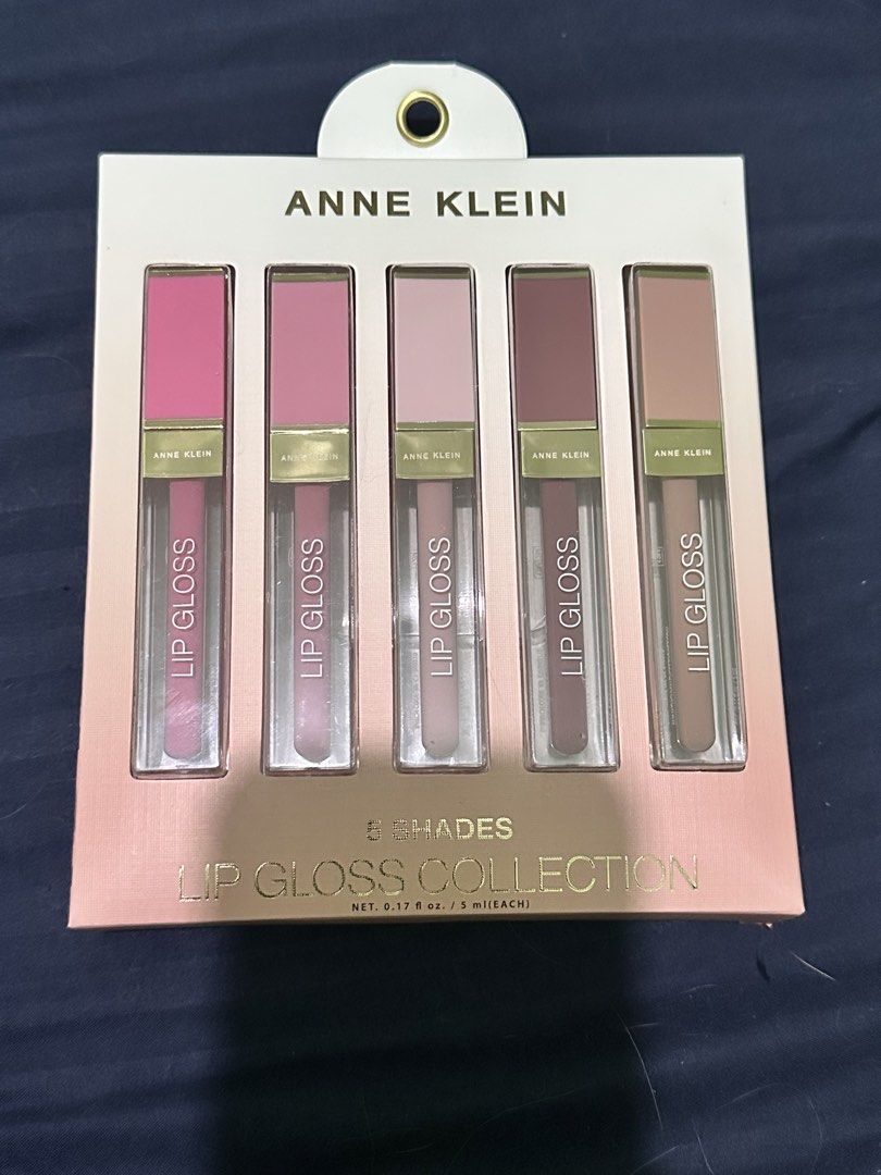Anne Klein 5 Shades Lip Gloss Collection (Category: Makeup) located in Quezon City. Submitted by _meffenamic (Listing ID 1448084197, Image 1). Description: - Set of 5 Anne Klein lip glosses - Includes a variety of nude and pink shades - Perfect for everyday wear or special occasions - Each tube is 5ml - Comes in a gift set packaging.