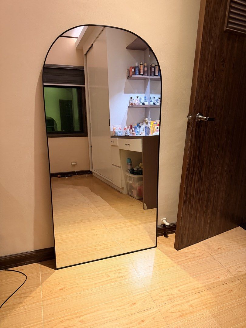 Arch Mirror with Black Frame (Category: Mirrors) located in Muntinlupa City. Submitted by cam.jea (Listing ID 1448247166, Image 1). Description: - Full length arch mirror - Sleek black metal frame - Ideal for entryway, bedroom, or living room - Enhances light and creates a sense of spaciousness - Easy to lean against any wall - Dimensions: Approx. 5 ft (height) x 2.5ft (width).