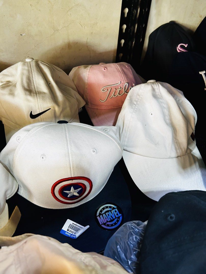 Assorted Caps and Bucket Hats - Vans, Nike, Marvel, Dodgers (Category: Caps & Hats) located in Manila. Submitted by starbalesukandjapansurplus (Listing ID 1448135532, Image 2). Description: - Assorted caps and bucket hats available. - Brands: Vans, Nike, Marvel, Dodgers, Titleist. - Plain options: White and pink caps. - Bucket hat colors: Red, blue, pink, grey. - Unique designs: Featuring items like Captain America..