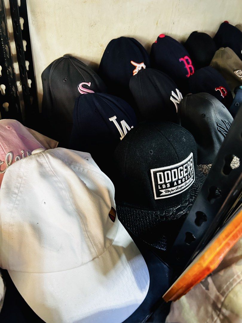 Assorted Caps and Bucket Hats - Vans, Nike, Marvel, Dodgers (Category: Caps & Hats) located in Manila. Submitted by starbalesukandjapansurplus (Listing ID 1448135532, Image 3). Description: - Assorted caps and bucket hats available. - Brands: Vans, Nike, Marvel, Dodgers, Titleist. - Plain options: White and pink caps. - Bucket hat colors: Red, blue, pink, grey. - Unique designs: Featuring items like Captain America..