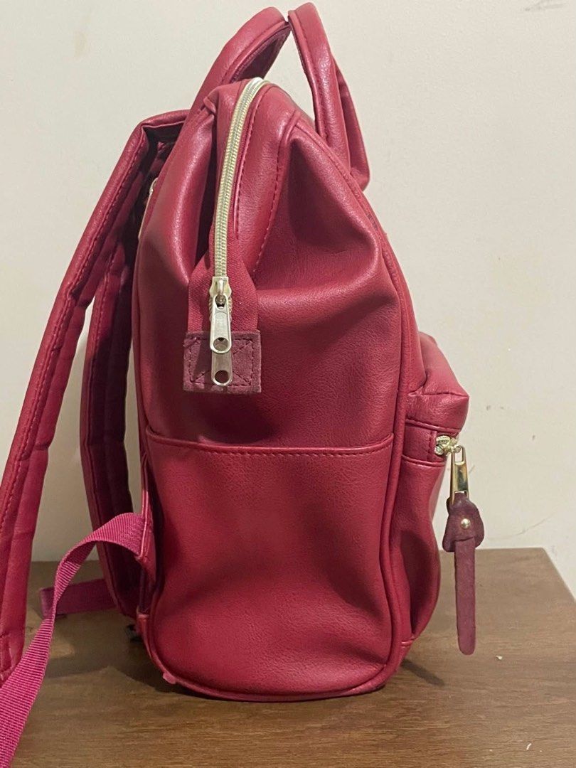 Authentic Anello Burgundy Red Faux Leather Backpack (Category: Backpacks) located in Manila. Submitted by lovenice (Listing ID 1448229272, Image 3). Description: - Price is fixed already ‼️ - Bought this from sm megamall for 3k - Noticeable flaw on right (as seen in picture) - Overall, still in good functionality and condition - Mini Size (seen when wearing).