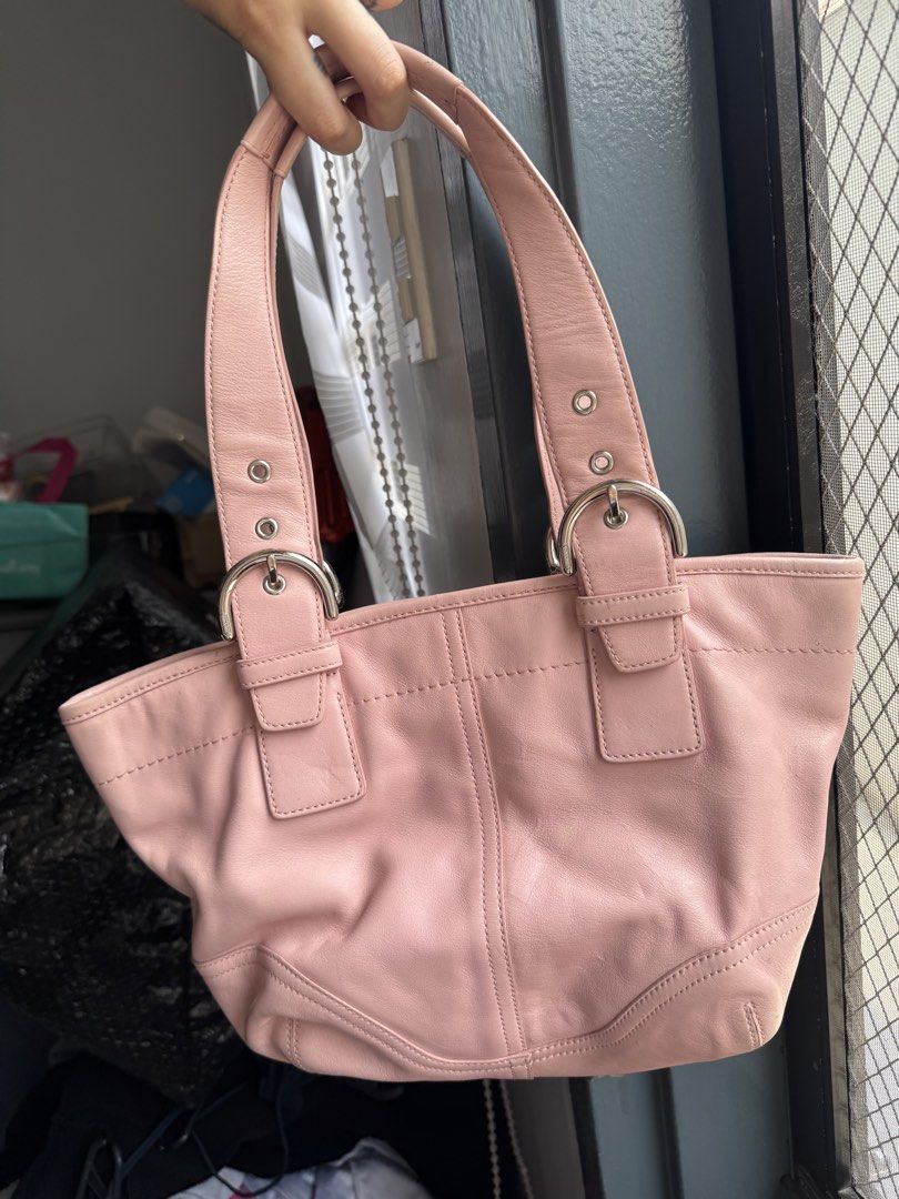 Authentic SOHO Coach Pink Leather Tote Bag (RARE)| Preloved (Category: Luxury Bags & Wallets) located in Taguig. Submitted by picklerubber (Listing ID 1448127421, Image 2). Description: 🌸 Authentic Coach Leather Tote Bag Selling this authentic Coach tote in a gorgeous soft pink color. Made from genuine leather with silver-tone hardware. Perfect for everyday use, work, school, or casual outings. Condition: • Good preloved condition • Normal signs