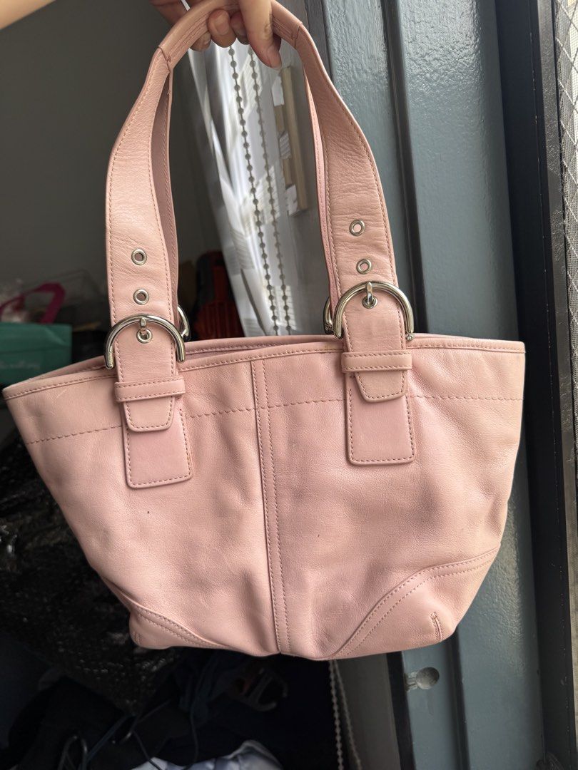 Authentic SOHO Coach Pink Leather Tote Bag (RARE)| Preloved (Category: Luxury Bags & Wallets) located in Taguig. Submitted by picklerubber (Listing ID 1448127421, Image 1). Description: 🌸 Authentic Coach Leather Tote Bag Selling this authentic Coach tote in a gorgeous soft pink color. Made from genuine leather with silver-tone hardware. Perfect for everyday use, work, school, or casual outings. Condition: • Good preloved condition • Normal signs