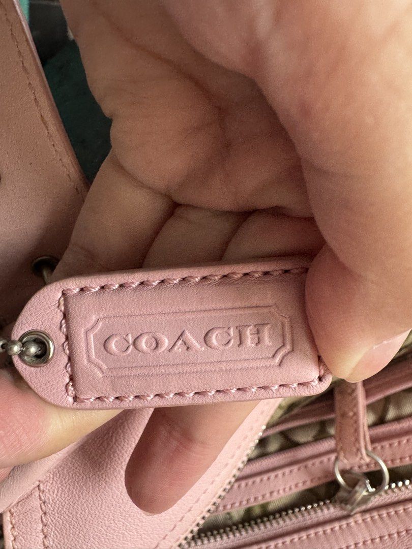 Authentic SOHO Coach Pink Leather Tote Bag (RARE)| Preloved (Category: Luxury Bags & Wallets) located in Taguig. Submitted by picklerubber (Listing ID 1448127421, Image 3). Description: 🌸 Authentic Coach Leather Tote Bag Selling this authentic Coach tote in a gorgeous soft pink color. Made from genuine leather with silver-tone hardware. Perfect for everyday use, work, school, or casual outings. Condition: • Good preloved condition • Normal signs