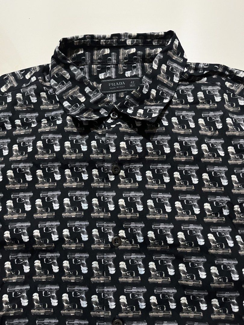 AW2012 PRADA ICONIC GUN PRINT SHIRT (Category: Luxury Apparel) located in Cagayan de Oro. Submitted by middlesosa (Listing ID 1448170851, Image 3). Description: AW2012 PRADA ICONIC GUN PRINT SHIRT SIZE LARGE FITTINGS WIDTH - 21 inches LENGTH - 30 inches SLEEVE - 27 inches SHOULDER - 18 inches MADE IN ITALY AUTHENTIC CUT WASHTAG EXCELLENT CONDITION 10k pesos.