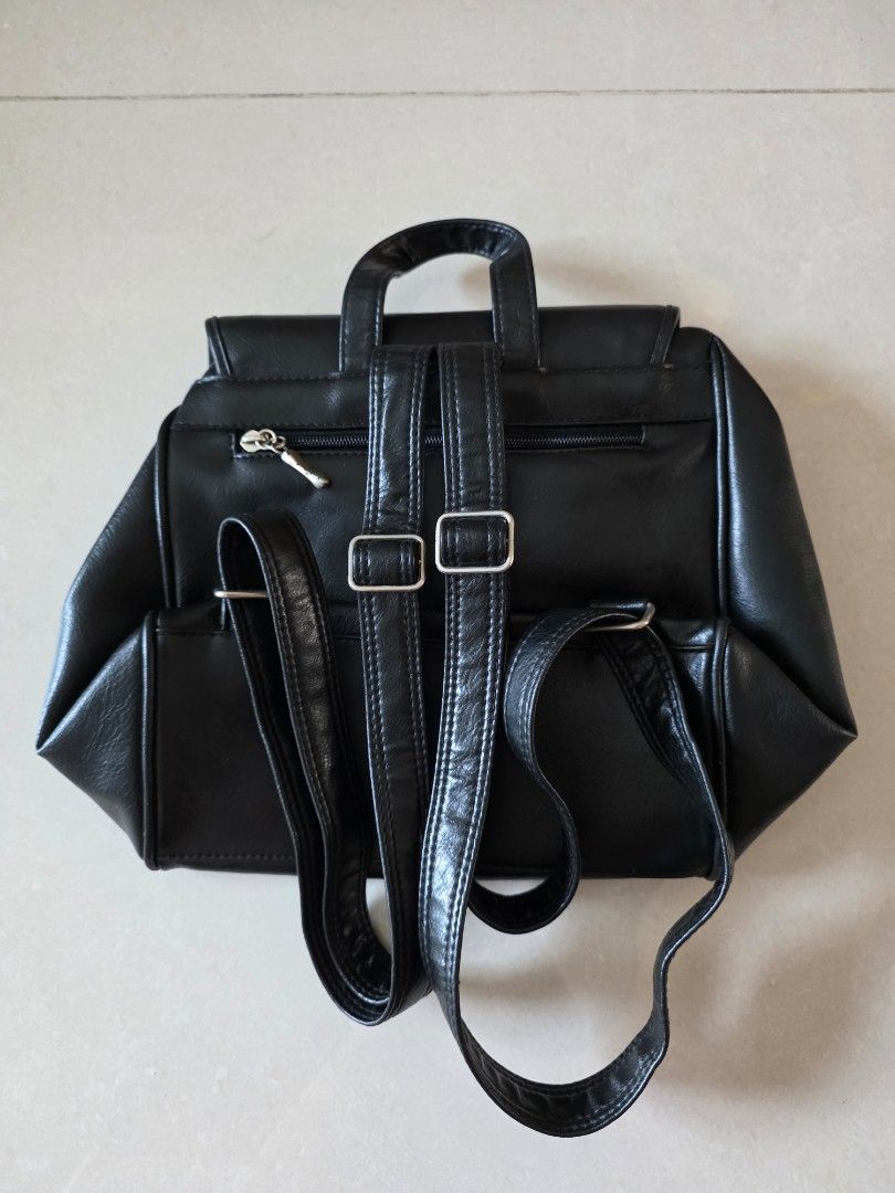 Backpack (Category: Backpacks) located in Singapore. Submitted by flyingdonkey (Listing ID 1448169006, Image 2). Description: Condition: Preloved 8/10 If I am not wrong, should be leather material. Bought in Germany Size: 25x26x18l0cm.
