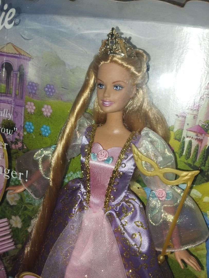 Barbie Rapunzel Dolls (Category: Kids Toys) located in Caloocan City. Submitted by dollforless11 (Listing ID 1448185838, Image 3). Description: - Barbie Rapunzel doll in original packaging - Features magical hair that grows longer - Includes a brush for styling.