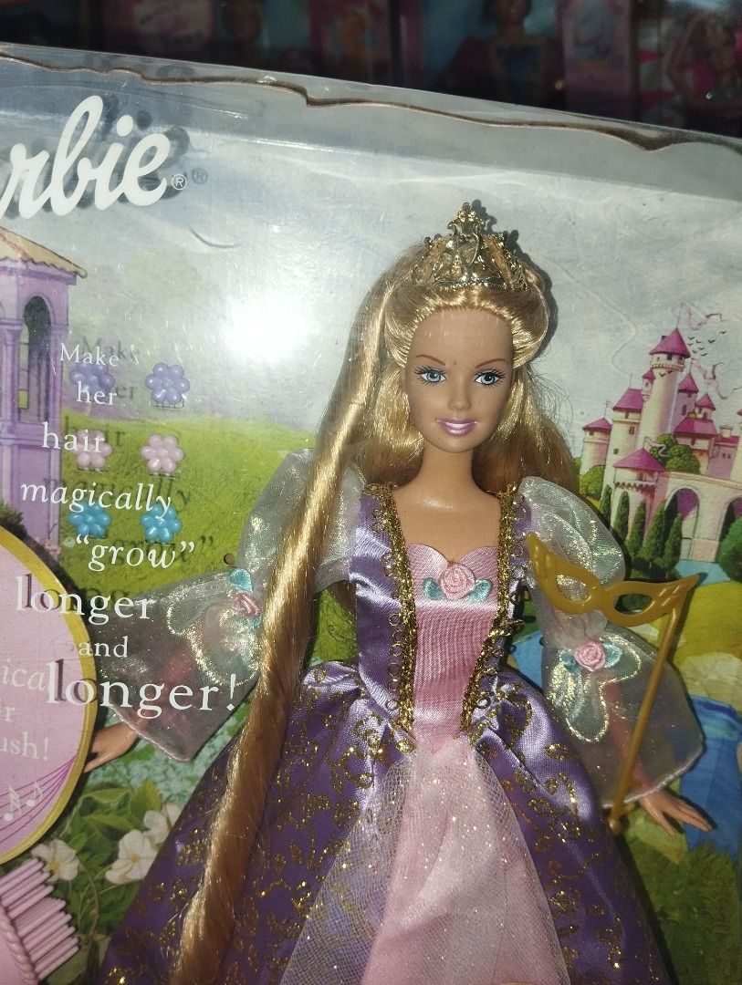 Barbie Rapunzel Dolls (Category: Kids Toys) located in Caloocan City. Submitted by dollforless11 (Listing ID 1448185838, Image 2). Description: - Barbie Rapunzel doll in original packaging - Features magical hair that grows longer - Includes a brush for styling.