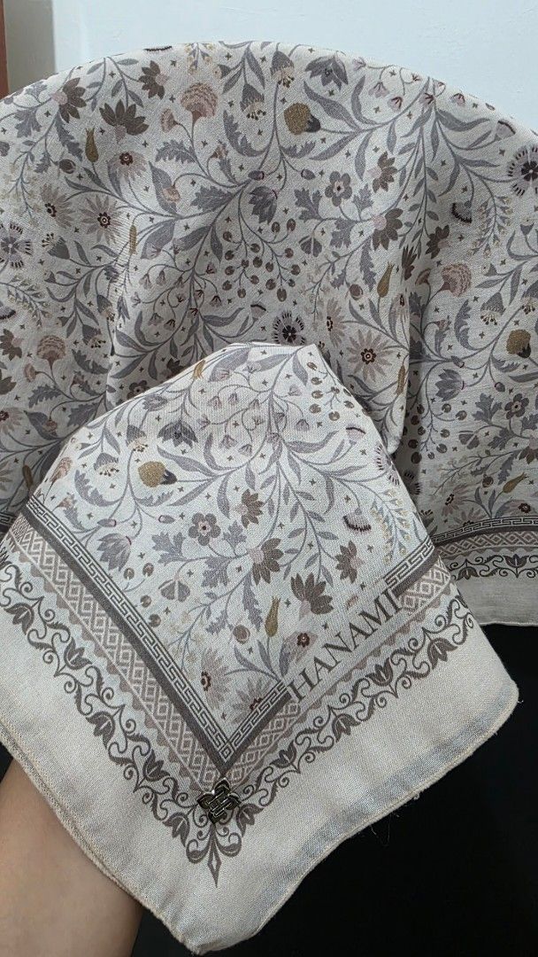Bawal Hanami (Category: Hijabs) located in Gua Musang. Submitted by emaghn (Listing ID 1448184789, Image 3). Description: - Set of 5 beautiful Hanami scarves - Each scarf features a unique floral print - Variety of background colors (dark and light options) - 'HANAMI' brand name visible on some scarves - Ideal for accessorizing and elevating your outfits - Fantastic bundle deal for all 5 scarves.