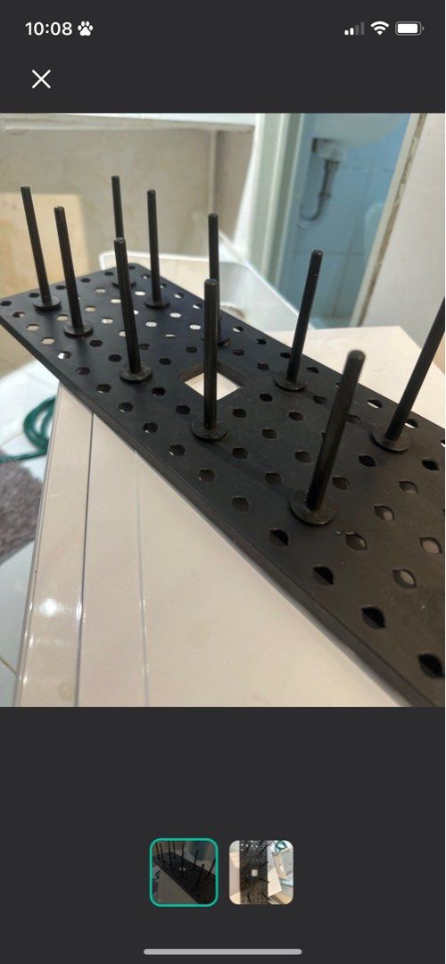 Black Metal drying rack Pegboard with Pegs (Category: Wall Decor) located in Quezon City. Submitted by trisssh0 (Listing ID 1448090161, Image 1). Description: - Black metal pegboard with multiple pegs - Ideal for organizing tools, craft supplies, or workshop items - Features a versatile grid of holes for customizable arrangement - Sturdy construction for durability - Ready to enhance your workshop or craft room organization.