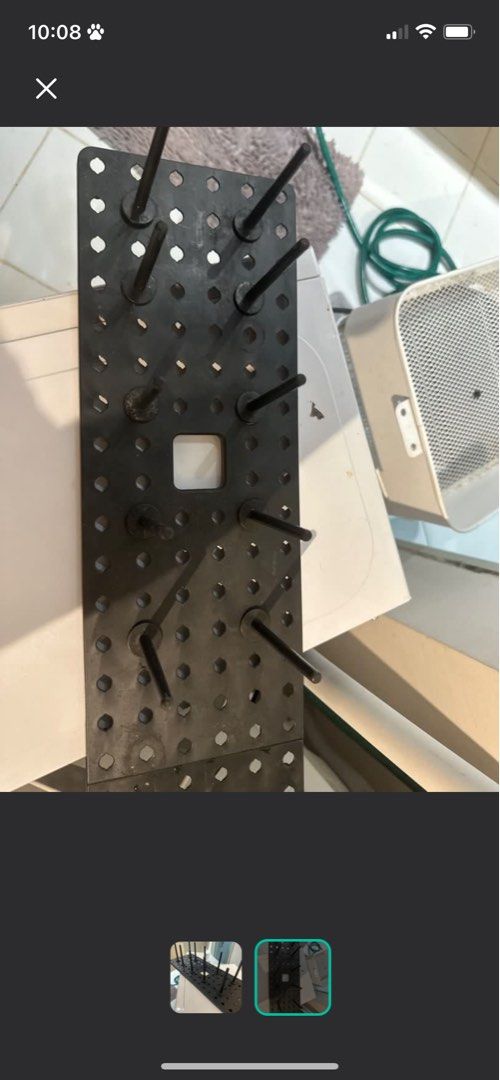 Black Metal drying rack Pegboard with Pegs (Category: Wall Decor) located in Quezon City. Submitted by trisssh0 (Listing ID 1448090161, Image 2). Description: - Black metal pegboard with multiple pegs - Ideal for organizing tools, craft supplies, or workshop items - Features a versatile grid of holes for customizable arrangement - Sturdy construction for durability - Ready to enhance your workshop or craft room organization.
