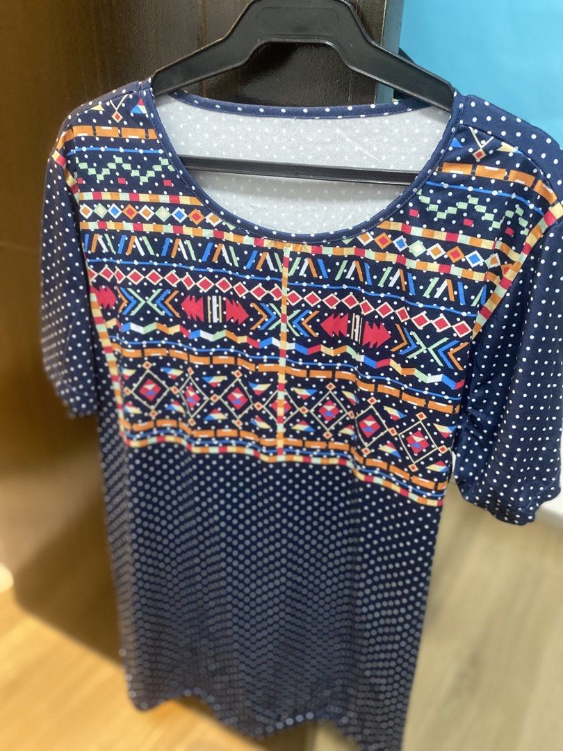 Blouse dotted blue wit print in front only (Category: Blouses) located in Quezon City. Submitted by bebothann (Listing ID 1448146455, Image 1). Description: Blouse blue dotted design with front print 1XL 95% polyester/ 5% spandex Made in Msde in china SF C/0 buyer.