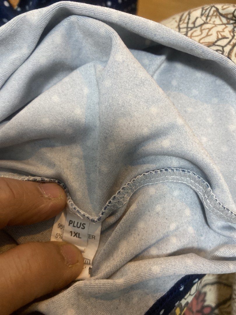 Blouse dotted blue wit print in front only (Category: Blouses) located in Quezon City. Submitted by bebothann (Listing ID 1448146455, Image 3). Description: Blouse blue dotted design with front print 1XL 95% polyester/ 5% spandex Made in Msde in china SF C/0 buyer.