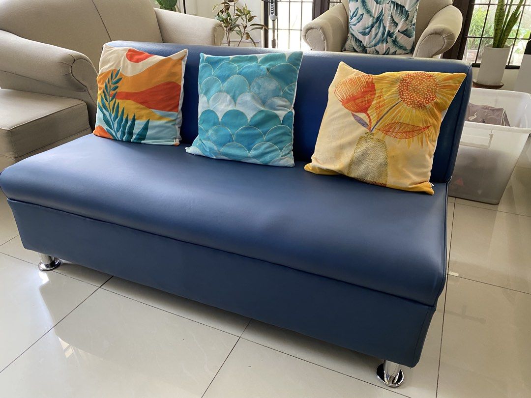 Blue Faux Leather 3-Seater Sofa (Category: Sofas) located in Quezon City. Submitted by rishlist (Listing ID 1448130358, Image 2). Description: - Blue faux leather 3-seater sofa - Compact size, ideal for smaller living spaces - Flaw: small mark on the seat (last photo) - in good, pre-loved condition - Please note: throwpillows not included - price negotiable 🏠 Batasan Hills, Qc.