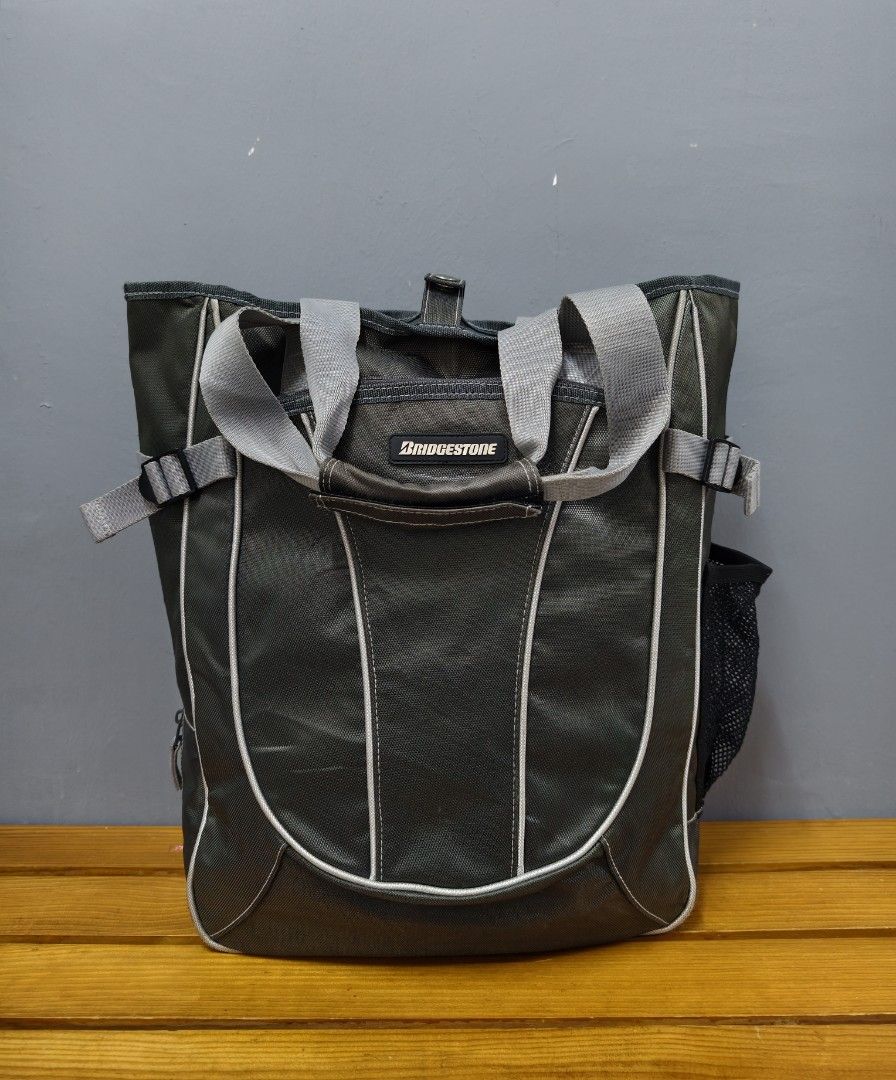 Bridgestone Tote Bag (Category: Tote Bags) located in Sungai Petani. Submitted by hatinuh (Listing ID 1448148194, Image 1). Description: Bridgestone Tote Bag ✅ Condition 9/10. Zip berfungsi lancar, bebas defect, faded dan pinhole. Ada sedikit stain bahagian pemegang (refer gambar). ✅ Ada zip bahagian bawah beg untuk melebarkan compartment beg. ✅ Saiz : 12.5 × 17.5 × 5 inci (panjang × tinggi × lebar) 💵 RM 40 🚚Postage DFOD J&T ⛔Color may differen