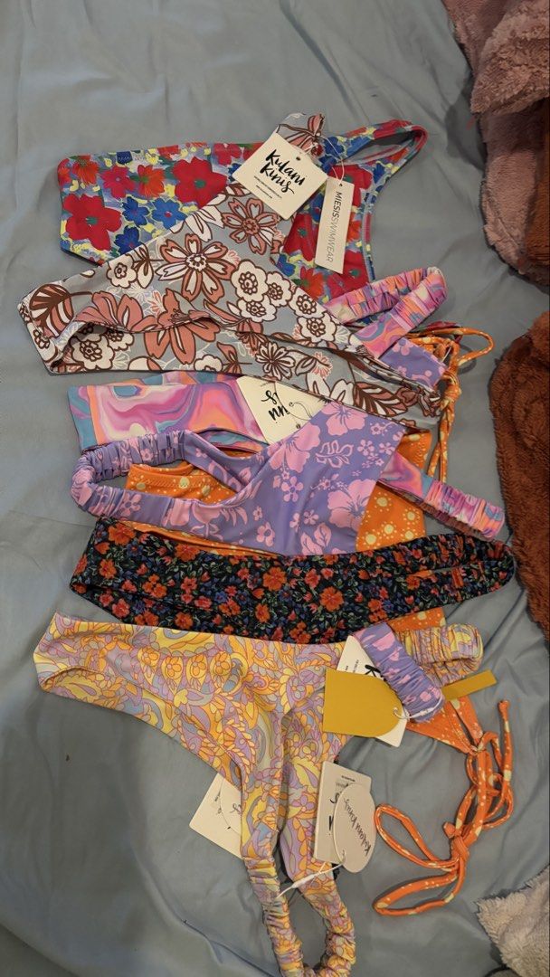 [bundle] Plus size Kulani Kinis & Miesis bottom wear - Various Prints (Category: Bikinis & Swimsuits) located in Quezon. Submitted by hooked_ (Listing ID 1448183193, Image 2). Description: - Brands: Kulani Kinis and Miesis Swimwear. - Features vibrant floral and abstract prints. - Perfect for beach days or lounging. - All items are new with tags attached. - Selling as bundle of 6 Kulani Kunis (2XL) and 1 Miesis (XL) BOTTOM WEAR ONLY Ships from Po