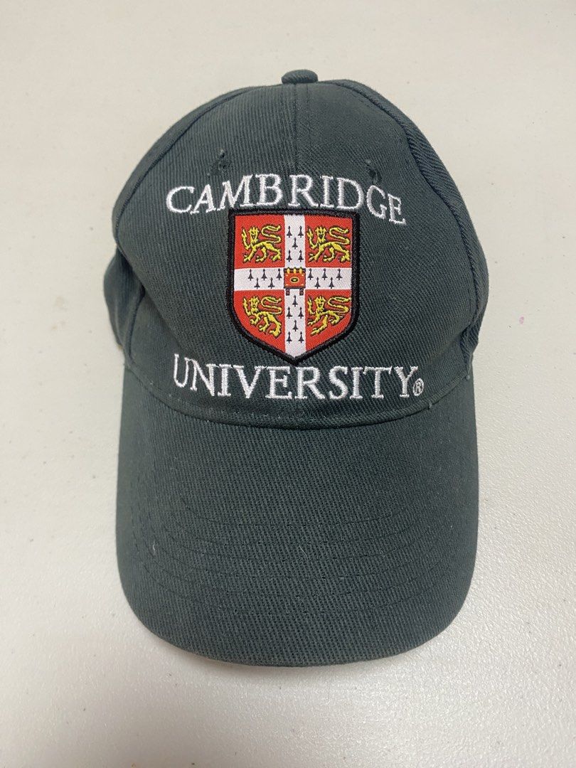 Cambridge University Official Merchandise Cap (Category: Caps & Hats) located in Taguig. Submitted by thriftdee (Listing ID 1448126640, Image 1). Description: - Official dark green cap from Cambridge University - Features the iconic university crest embroidered on the front - Adjustable strap at the back for a comfortable fit - Ideal for Cambridge alumni, students, or fans.