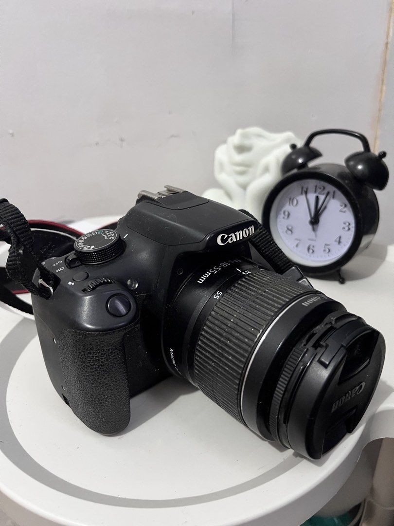 Canon EOS 1300D DSLR Camera with 18-55mm Lens (Category: Cameras) located in Manila. Submitted by kyla.esca (Listing ID 1448107501, Image 1). Description: - Canon EOS 1300D camera - Includes standard 18-55mm lens - Ideal for beginners or photography enthusiasts - Strap included - Ready for your next adventure.