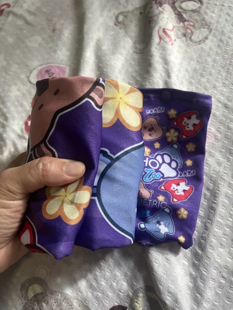 Carry on luggage cover (Category: Luggage) located in San Juan City. Submitted by iambernie (Listing ID 1448081996, Image 3). Description: - Adorable purple luggage cover featuring fun Ortho Zoo characters (bears & penguins). - size is approx 18 inches width and height but it’s stretchable for one hand carry luggage - Convenient snap closure at the bottom for easy fastening. - Made from soft, stretchy material. - Compact and foldable design, idea