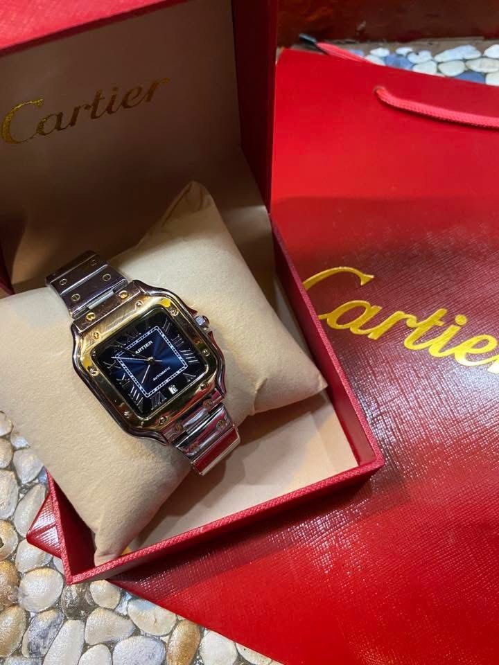Cartier Santos Automatic Two-Tone Watch (Category: Luxury Watches) located in Manila. Submitted by thrifttodays. (Listing ID 1448188676, Image 2). Description: - Elegant Two-Tone Design - Captivating Blue Dial - Reliable Automatic Movement - Convenient Date Display - Includes Box and Shopping Bag - Ideal for Collectors and Classic Watch Lovers - Feel free to message with any questions!.