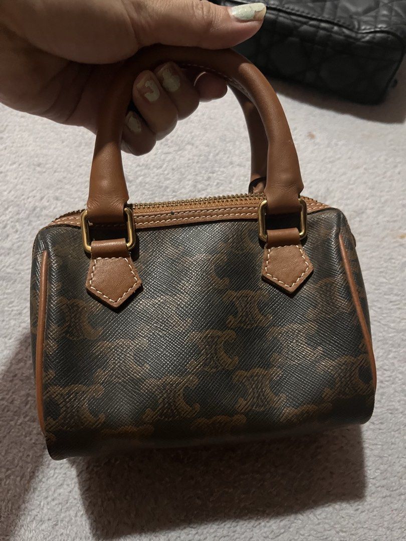 Celine Mini Boston Bag Brown Monogram (Category: Luxury Bags & Wallets) located in Manila. Submitted by japanluxpallete (Listing ID 1448079439, Image 1). Description: - Super cute mini Boston bag - Classic Celine monogram print - Brown and tan colorway - Leather trim and handles - Zipper closure - Made in Italy - Small size, great for essentials.